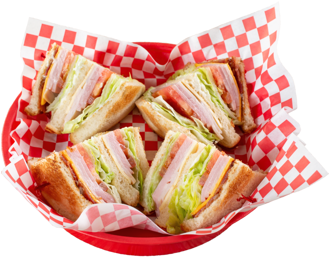 Stacked club sandwich with ham, turkey, and bacon